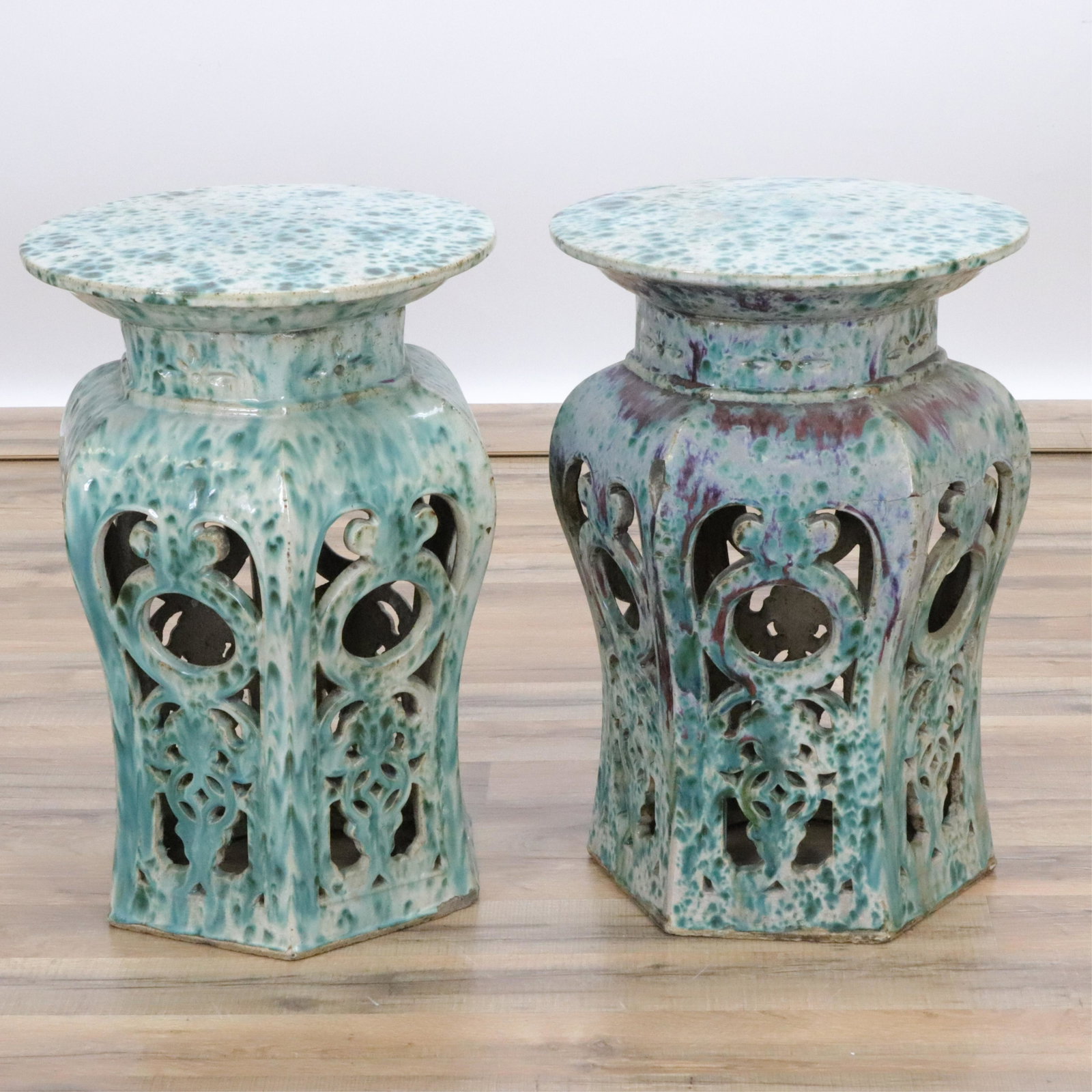 Pair Glazed Garden Stands: Pair Glazed Garden Stands, 20th century Hexagonal ceramic stands with pierced sides and mottled green glaze. Dimensions::21 " high x 14" diameter each Property from a Colts Neck, New Jersey collection
