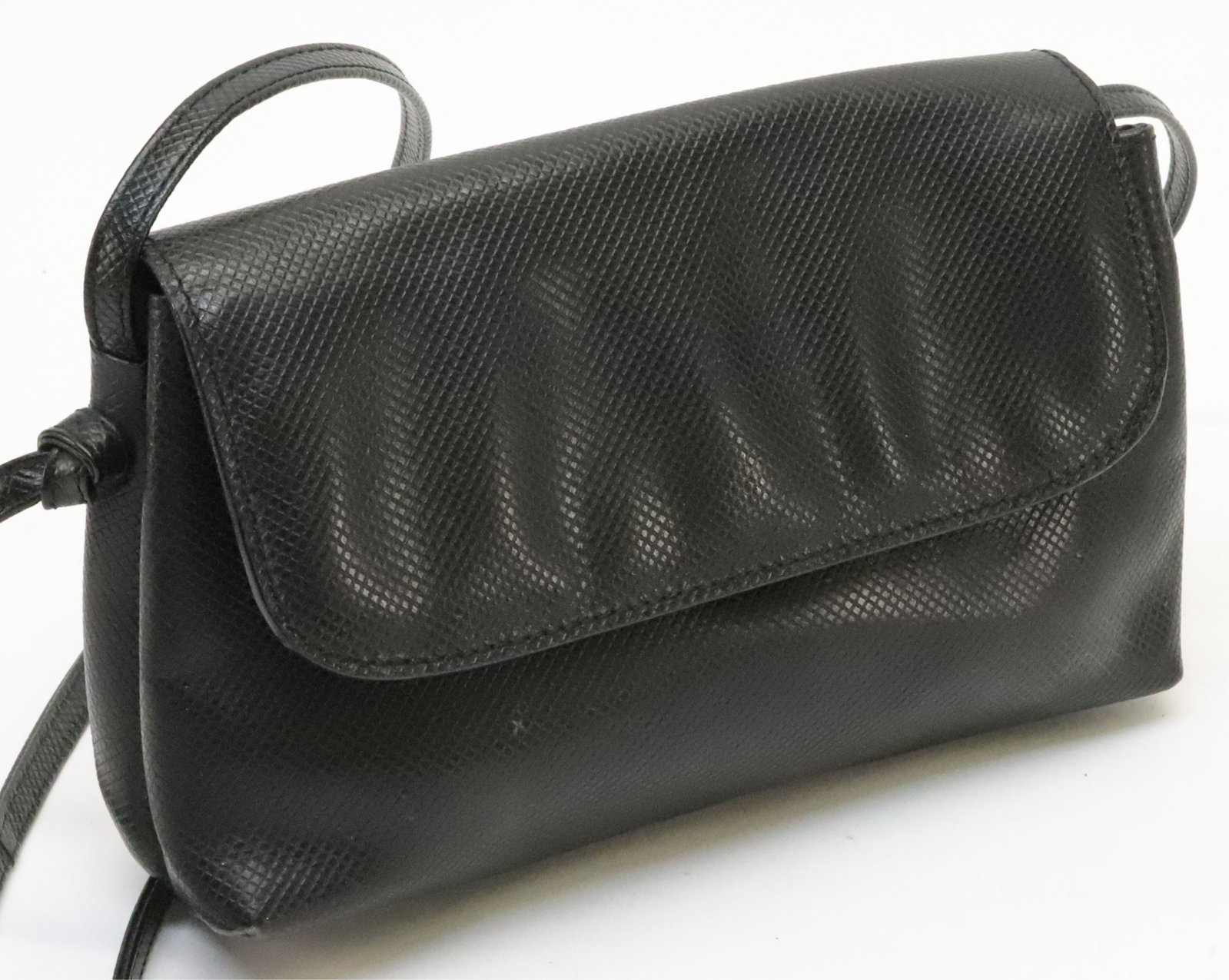 Bottega Veneta Leather Crossbody: A vintage Bottega Veneta crossbody in black diamond texture leather with smooth black leather interior. Dual compartment with single zip pocket. 5 x 8.5 2.5. Shoulder drop 24" Property from a Northwes