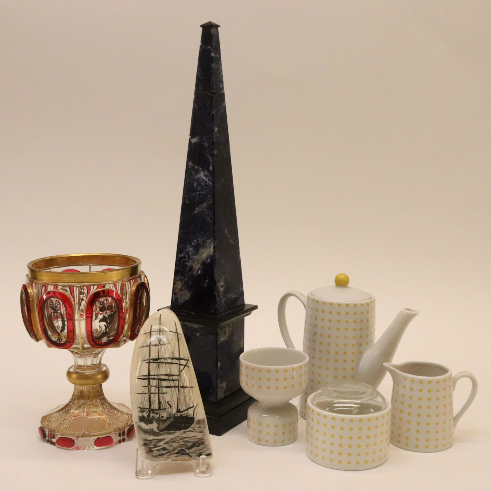 Porcelain, Bohemian Glass & Lapis Table Objects: Group of Porcelain, Bohemian Glass & Lapis Table Objects, obelisk, goblet, 4-pc. Tea service, faux scrimshaw tooth Dimensions: Largest 15 3/4" H Property from the collection of Isabella Leeds, removed