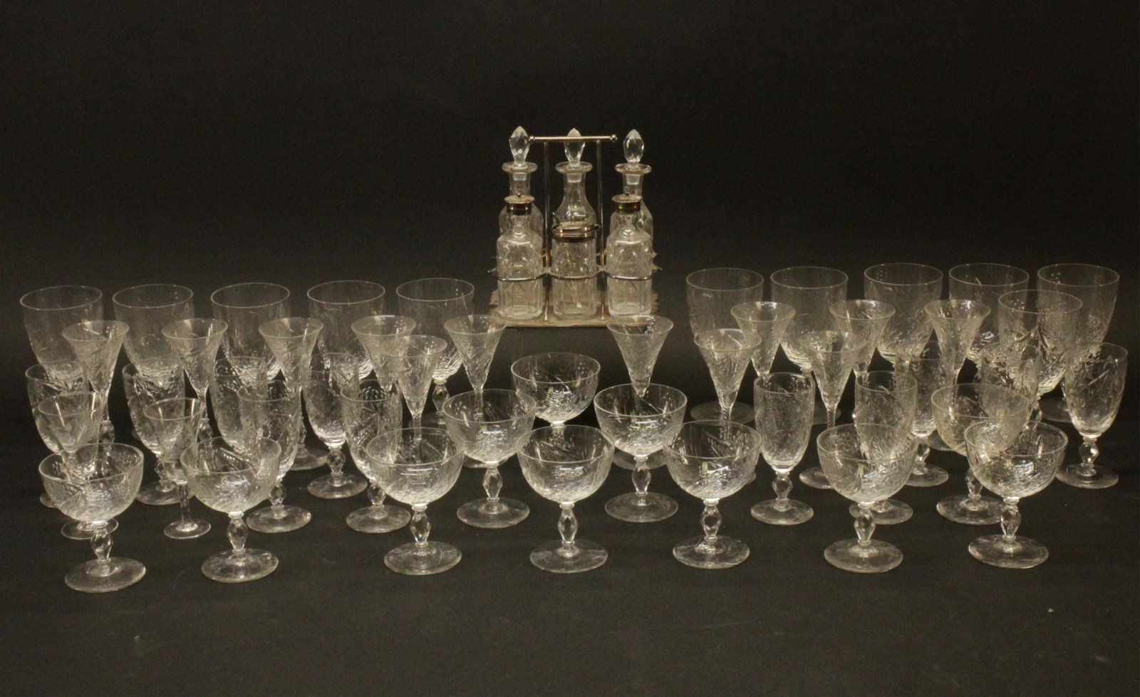 Edwardian Etched Crystal Stemware & Cruets: Edwardian Etched Crystal Stemware Set and Cruet Set, 11 red wine, 11 champagne, 11 white wine, 12 cordial, 2 aperitif Dimensions: Cruet 8 1/4" H (WSIL514/48)(MS)
