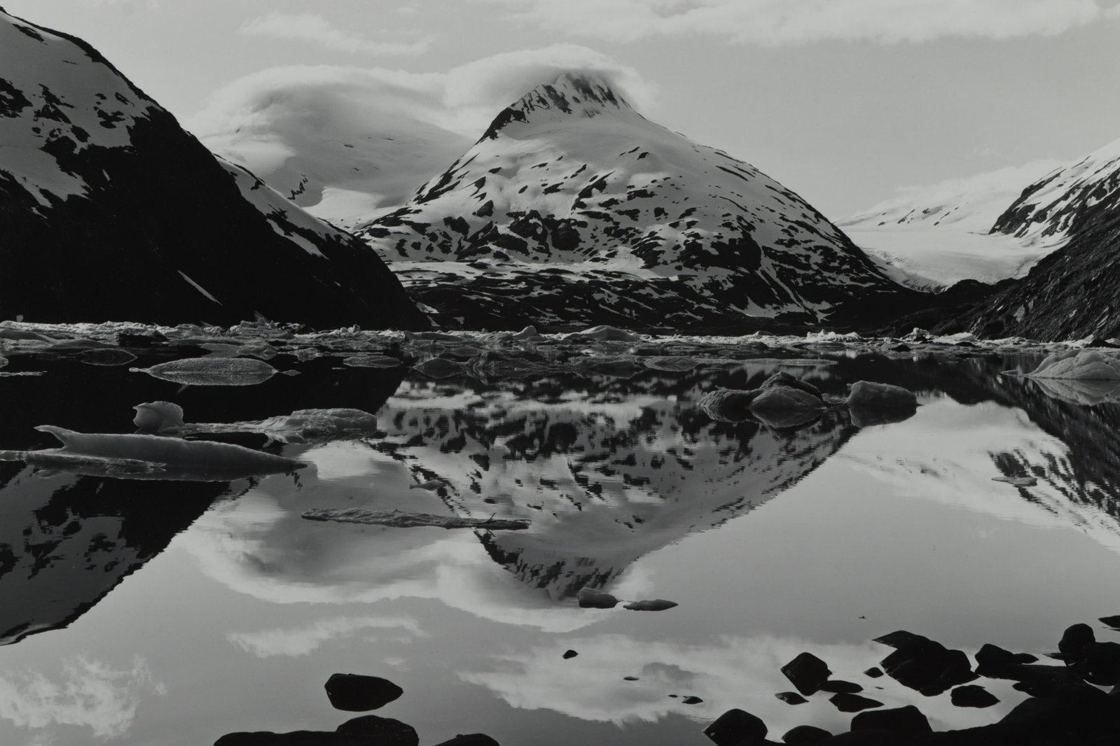 Daniel Jones - Photograph of Portage Lake, Alaska: Daniel Jones (American, 20th C) gelatin silver print of Portage Lake, Alaska, signed lower right, numbered 8/10 lower left, artist stamp with title and dates verso. Dimensions: 11 x 14, matted 19 x 21