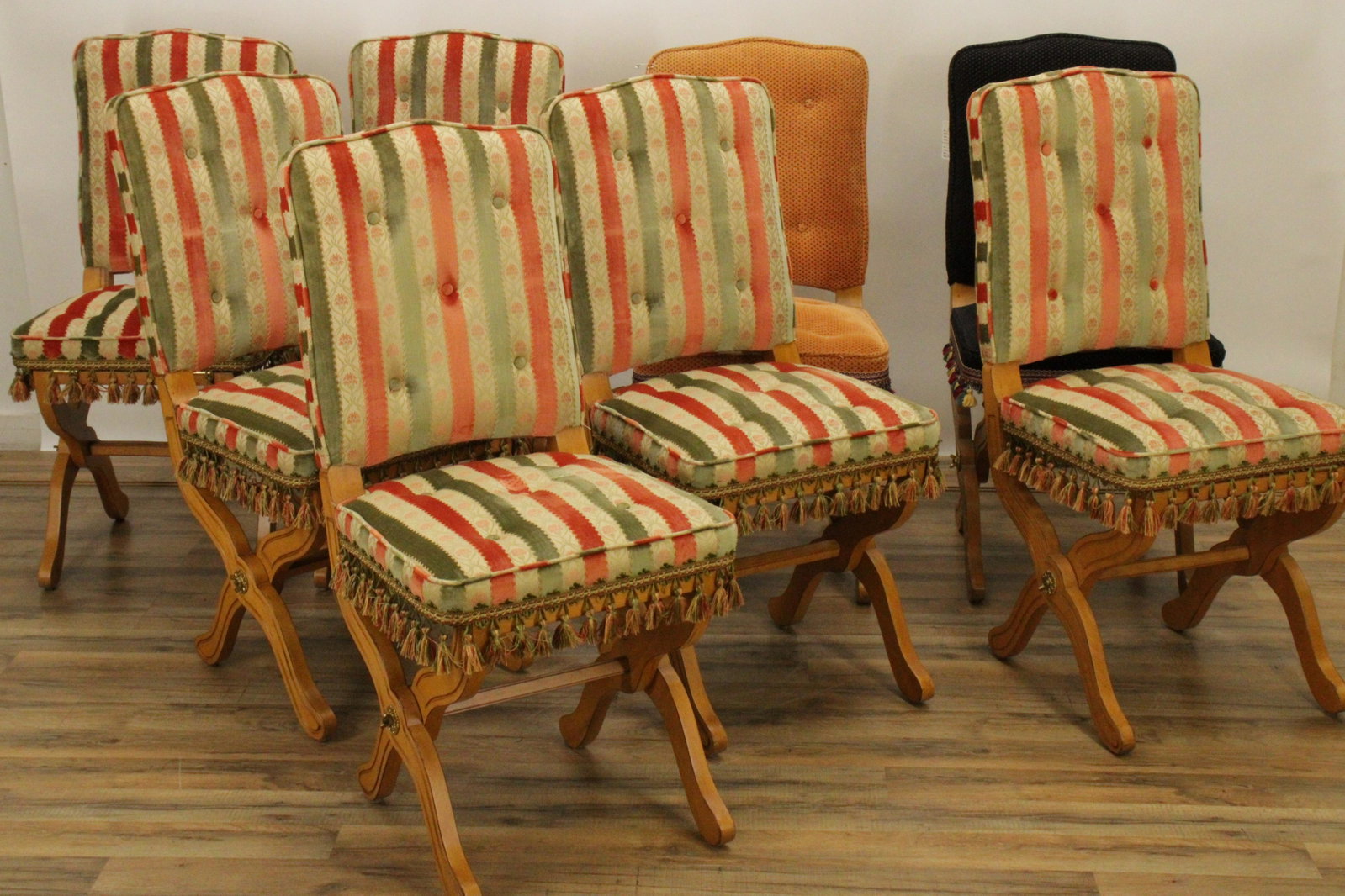 Set of Maple Folding Chairs: Set of Maple Folding Chairs, 6 with striped cut velvet upholstery, one with black upholstery, one with orange upholstery Dimensions: 38" H x 17" W x 22" D Property from the Private Collection of Steve