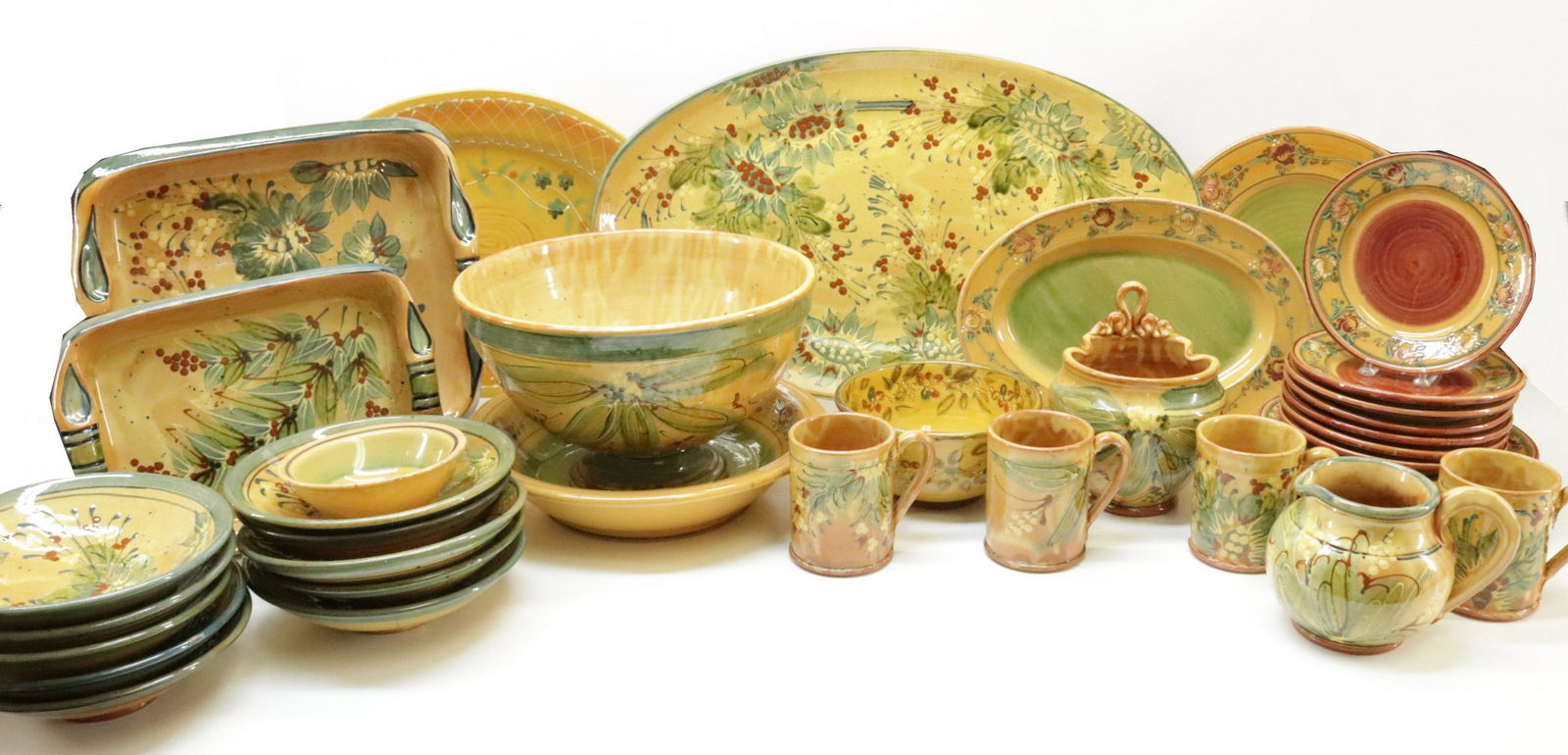 Large Assembled Grp Provincial French Pottery: A Large Assembled Collection of Provincial French Pottery Tableware, colorful floral decoration on brown/yellow/tan ground, variously marked Sud & Co., Casses en Provence, France; Veronique Pichon, Uz