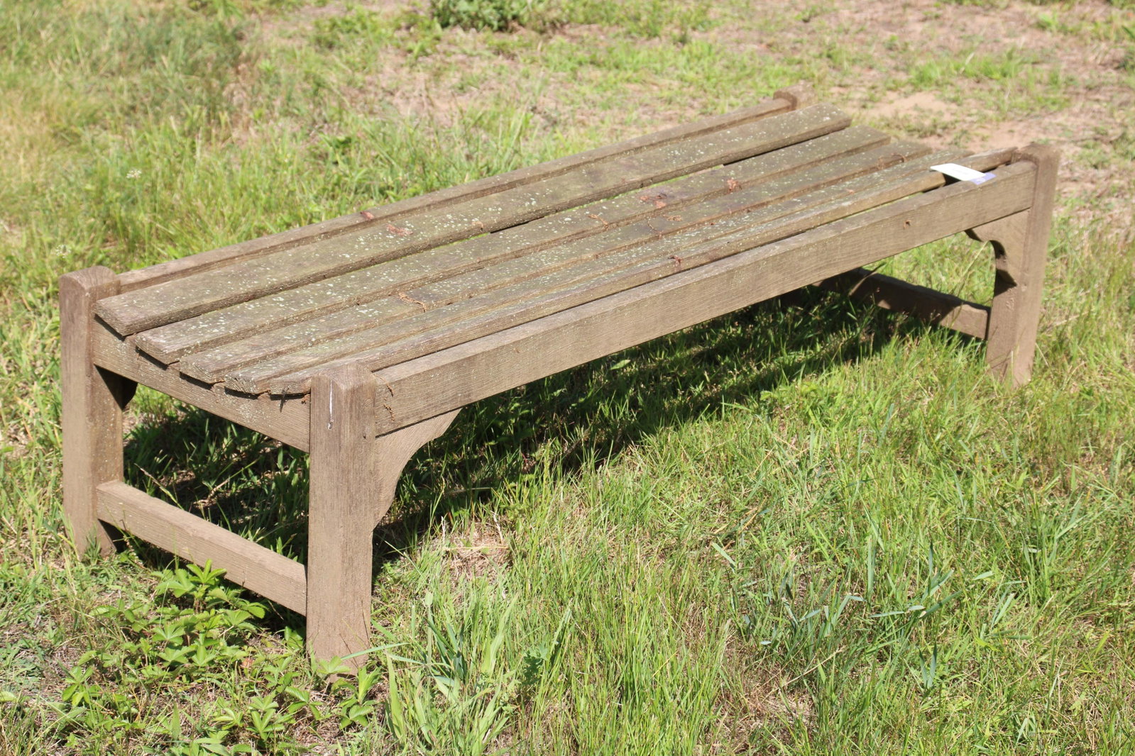 Teak Garden Saddle Bench: Teak Garden Saddle Bench Dimensions: 16" H x 58 1/2" W x 20" D Property from a Private Katonah Estate (KATO376)(MS)