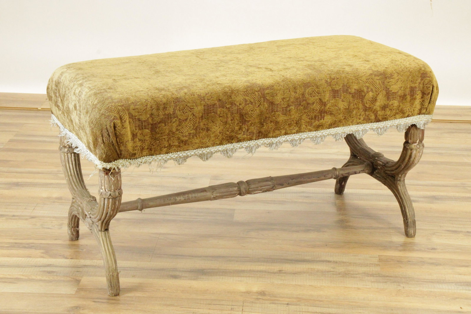 Classical Carved Wood Curule Form Bench: Opposing curves, single stretcher frame. Upholstered seat. Stripped finish with traces gold and white paint. Dimensions: 37"L x 17W x 19.5H (MRUB506)(JP)