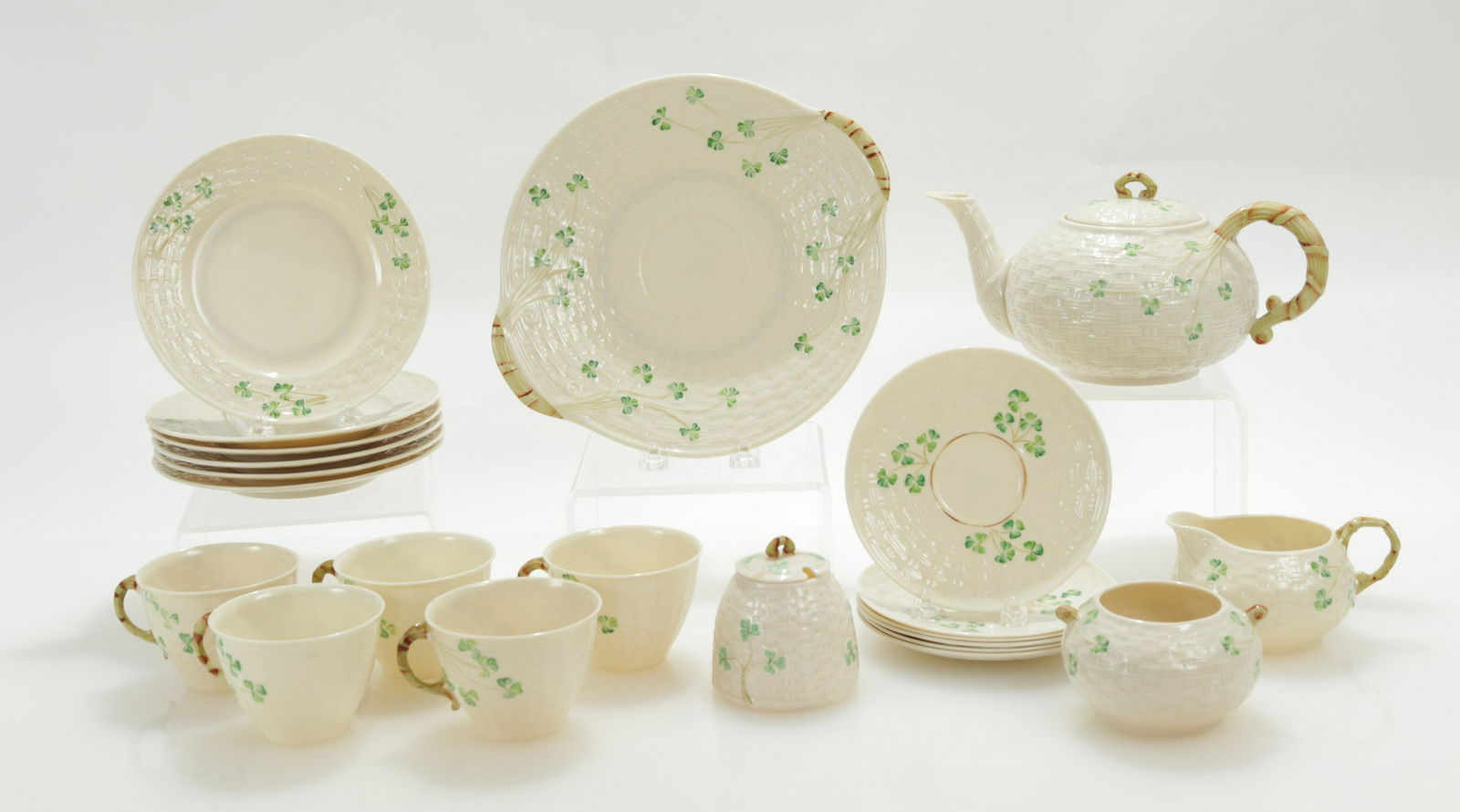 Belleek Tea Service for 6: Belleek Tea Service for 6, including a teapot, large plate, 6 dessert plates, 5 cups, 6 saucers, sugar, creamer & bowl Dimensions: Large plate 10 3/4" W Property from a Private Katonah Estate (KATO472