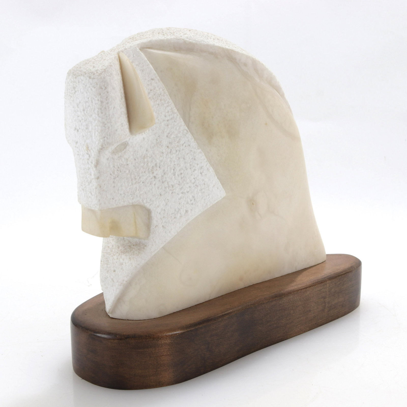 Veloy Vigil - Carved Alabaster Buffalo: Veloy Joseph Vigil (Taos, NM, 1931 - 1977). Carved alabaster buffalo. Signed V. Vigil, dated 1986. Affixed to wooden base. Dimensions: 10 H x 12 L x 4 W including base Property from a Chestnut Hill, M