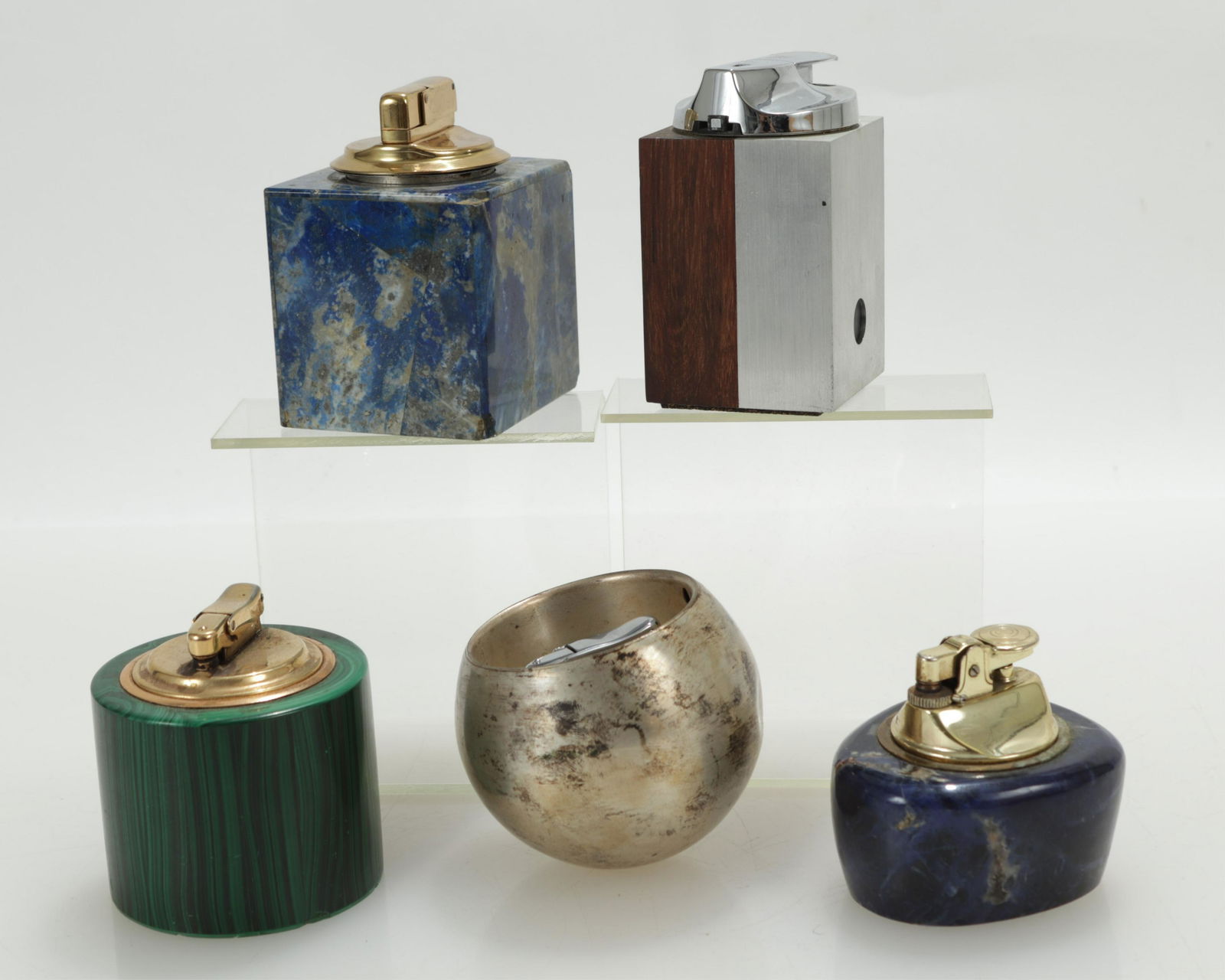 Group of Stone Lighters: Round Malachite, signed and stamped Ireland. Square Lapis Lazuli, oblong Lapis Lazuli. Round orb metal, metal and wood. Dimensions: Lapis 2.5" W x 4" H Property from a successful Sotheby's realtor, Ap