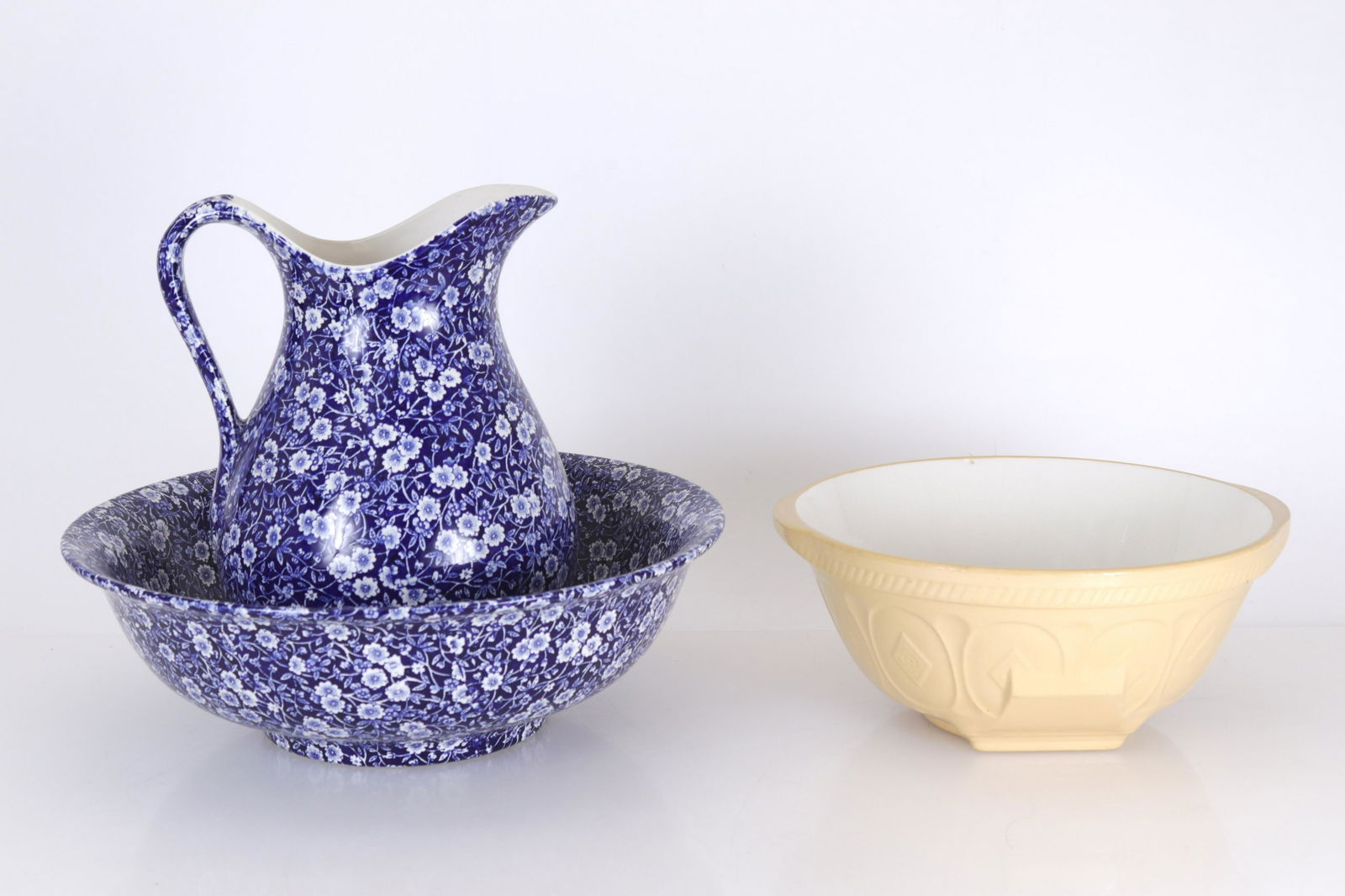 English Basin, Pitcher Set; Stoneware Mixing Bowl: Calico Burleigh porcelain pitcher and basin. "Easimix" T.G. Green & Co. LTD. glazed stoneware mixing bowl. Dimensions: pitcher 11.5"H basin 15 dia. x 5H bowl 11.75W with handles (EROG341/3)(JP)