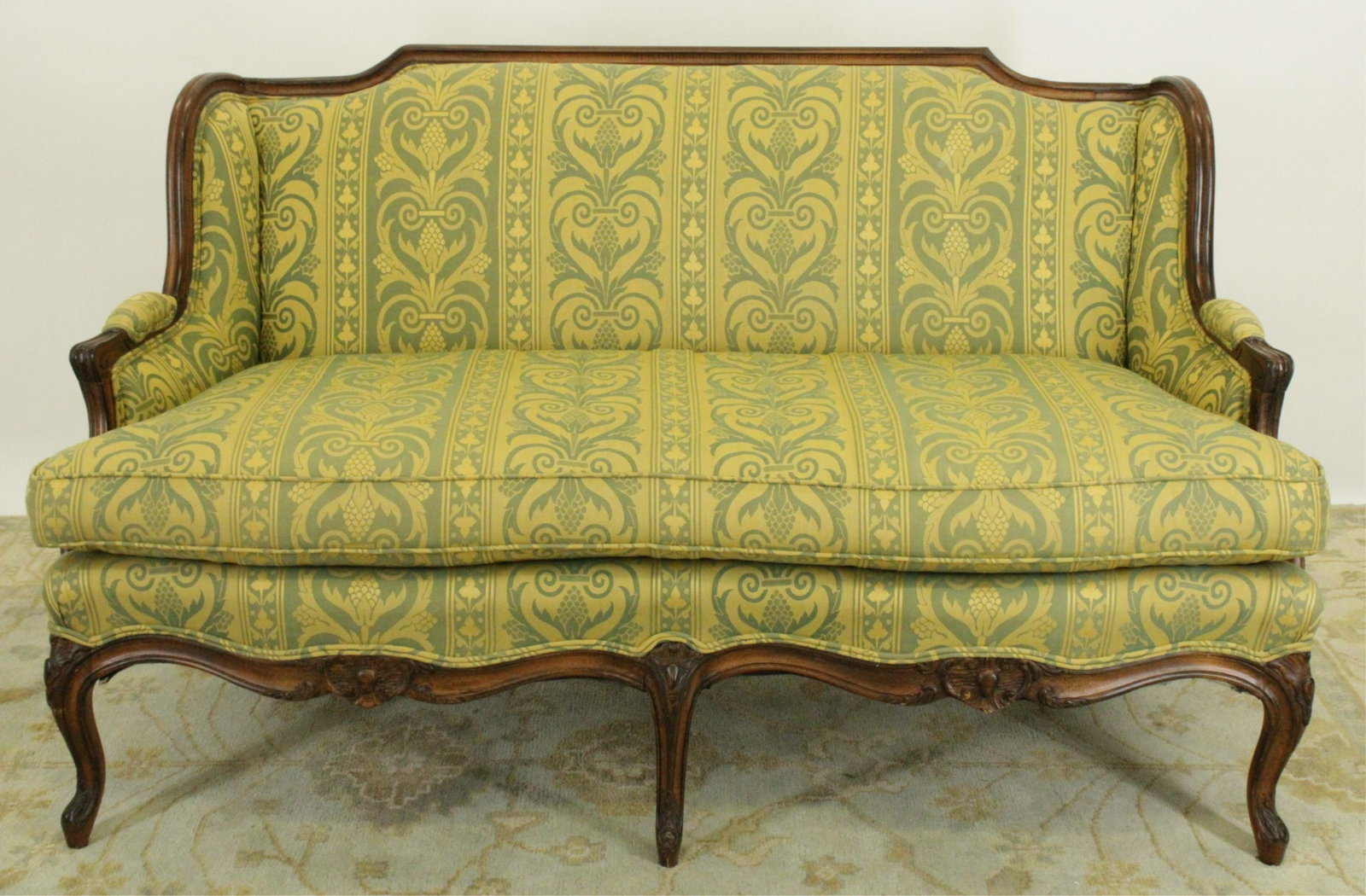 French Provincial Style Upholstered Loveseat: French Provincial Style Carved Wood and Upholstered Loveseat with grey green patterned fabric with gold base Dimensions: 33 1/2"H x 60"W x 33"D (MITK22)(MM)