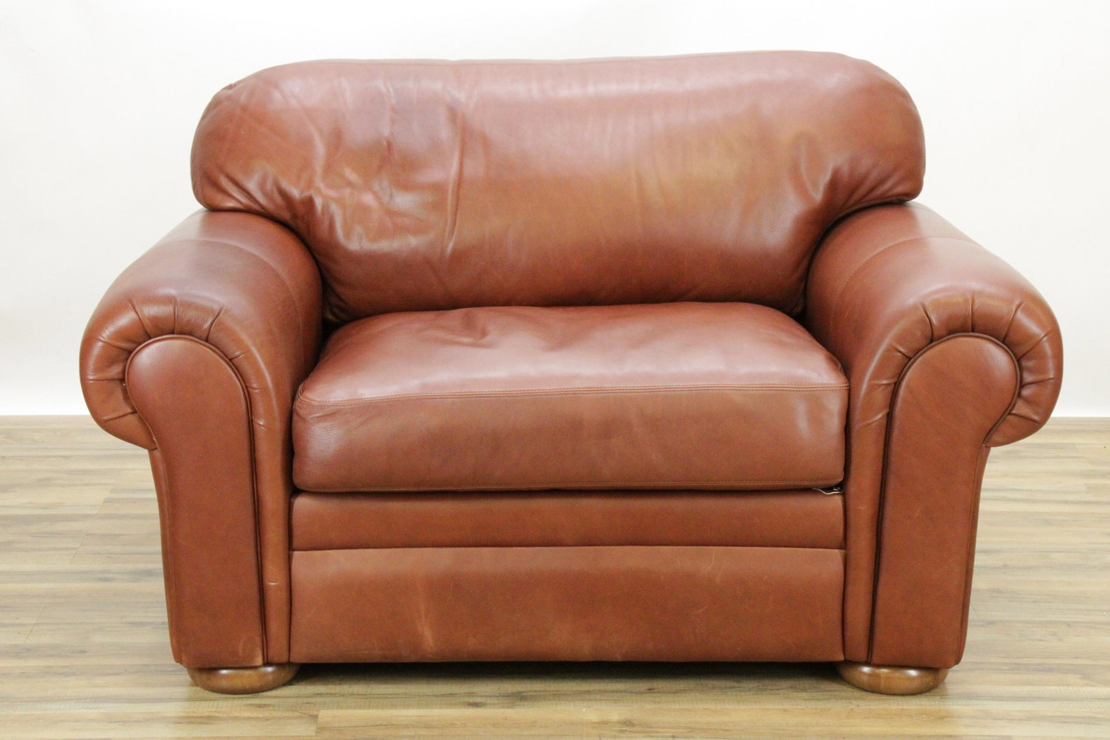 American Leather Upholstered Loveseat: American Leather Upholstered Loveseat, in brown leather Dimensions: 28 1/2" H x 56" W x 39" D (KATO11)(MS)