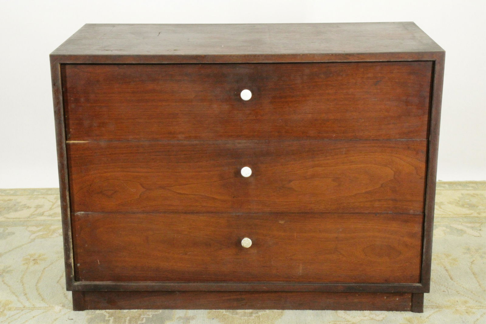 Door Store MCM Three Drawer Dresser C1950s: Door Store, (NYC). Walnut veneer. White porcelain pulls. Diagonal splines to case corners. Dimensions: 36" x 17.75 x 26.5H (IBAR164)(JP)
