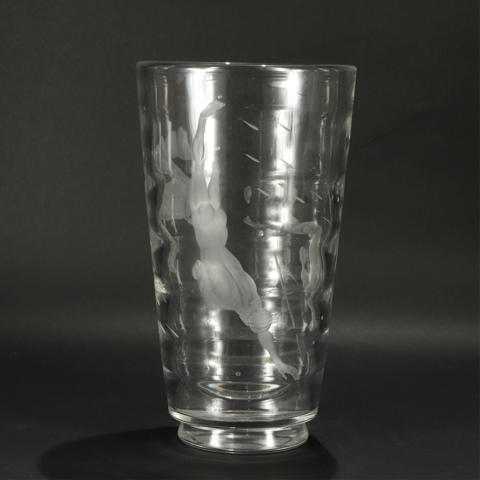 Vicke Lindstrand for Offefors Glass Vase: Vicke Lindstrand for Offefors, large ribbed glass vase with etched depiction of nude men swimming, diving, and crouching. Signed on bottom Dimensions: 13.5" H x 8" diam at top Property from a successf