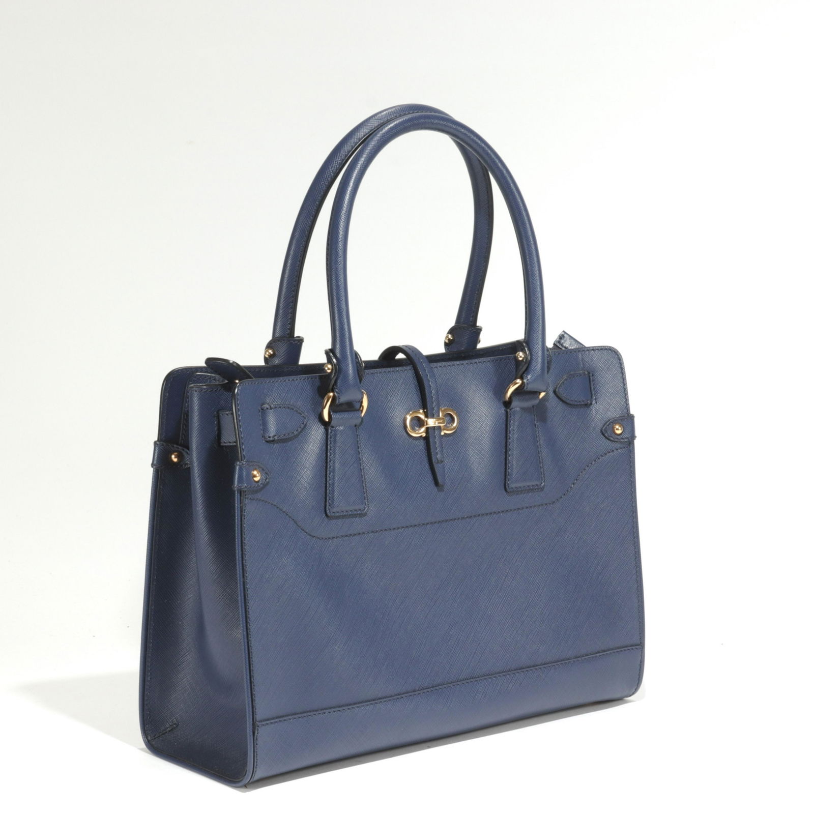 Salvatore Ferragamo Briana Leather Tote: Salvatore Ferragamo Briana Saffiano Leather Tote in navy blue. Exterior snap pocket, interior zip and slip pockets. Gold tone hardware. Includes dustbag. 9.5" x 12" x 4.25" 5.5" handle drop Property f