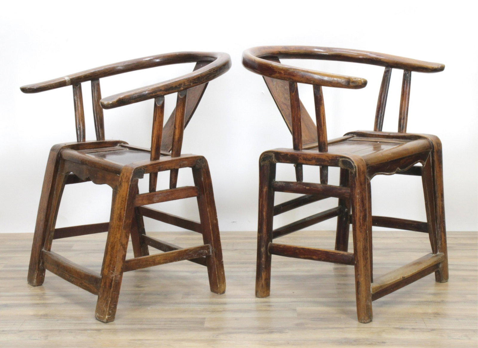 Pair Chinese Horseshoe-back Softwood Armchair: Pair Chinese Horseshoe-back Softwood Armchair, elm seat 34" H x 27 1/2" W x 24" D Property from a Manhattan collection