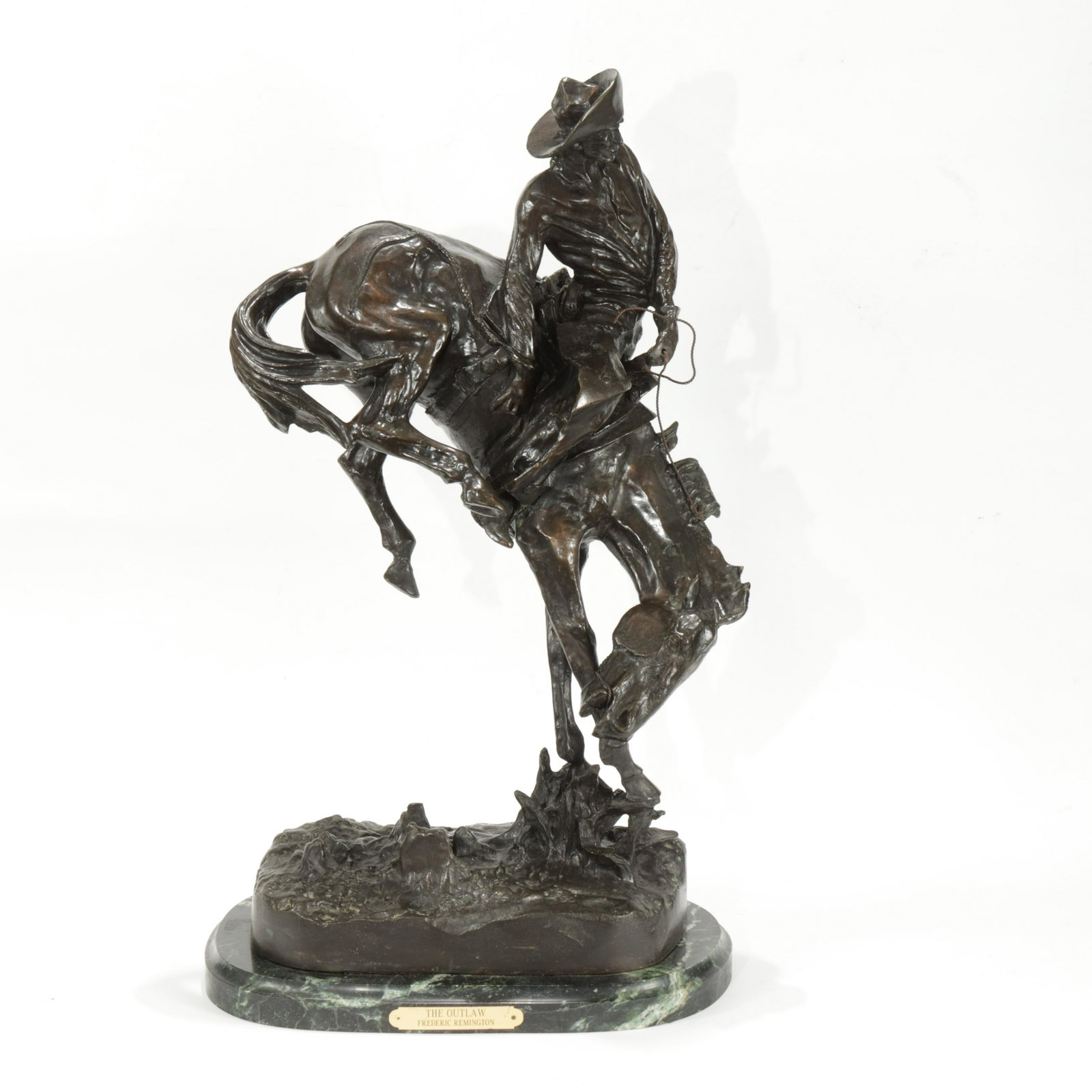 After Frederic Remington Bronze "The Outlaw": Bronze sculpture on green marble base. Braided wire reins. Cast incised signed on bronze base and stamped numbered 42 150. Plaque on marble base. 24.5"H overall. Bronze: 23.25H x 11 x 6.75