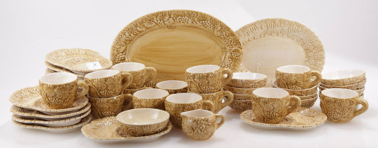 Italian Pottery Breakfast Service, Wolfman: Italian Pottery Breakfast Service, marked "Peria Rappa, P. Wolfman Design (c) 1996, Deruta Otaly", comprises: 14 plates, 13 cups, 12 bowls, 2 platters, 1 creamerDimensions: Plates 10 1/4" x 8", Smalle