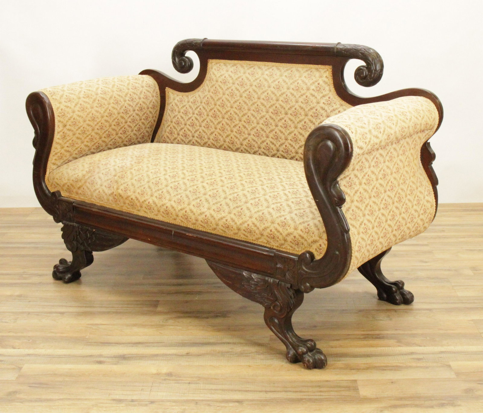 American Empire Style Mahogany Loveseat: American Empire Style Mahogany Loveseat, foliate brocadeDimensions: 36" H x 58" W x 26" D Shipping is the buyer's responsibility! We recommend obtaining a quote from a third party shipper prior to bid