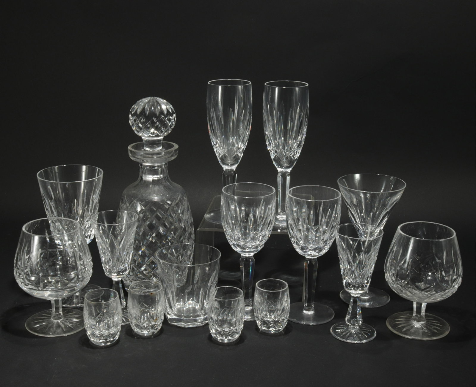Waterford Crystal Barware: Waterford Crystal Barware, includes 1 decanter, 2 champagne flutes, 2 white wine, 1 red wine, 1 martini, 1 tumbler, 4 shot glasses, 2 brandy, 2 cordialsDimensions: 2-11"H Shipping is the buyer's respo
