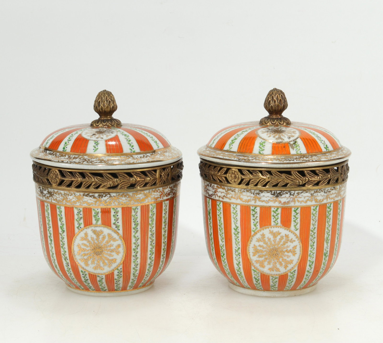 Pair of United Wilson Cache Pot: Pair of United Wilson Cache Pot. Orange and white striped with gold tone metal rim and knob. (LFIN729/2)(EL) Dimensions: 10.5" H to top of knob, 8" diam