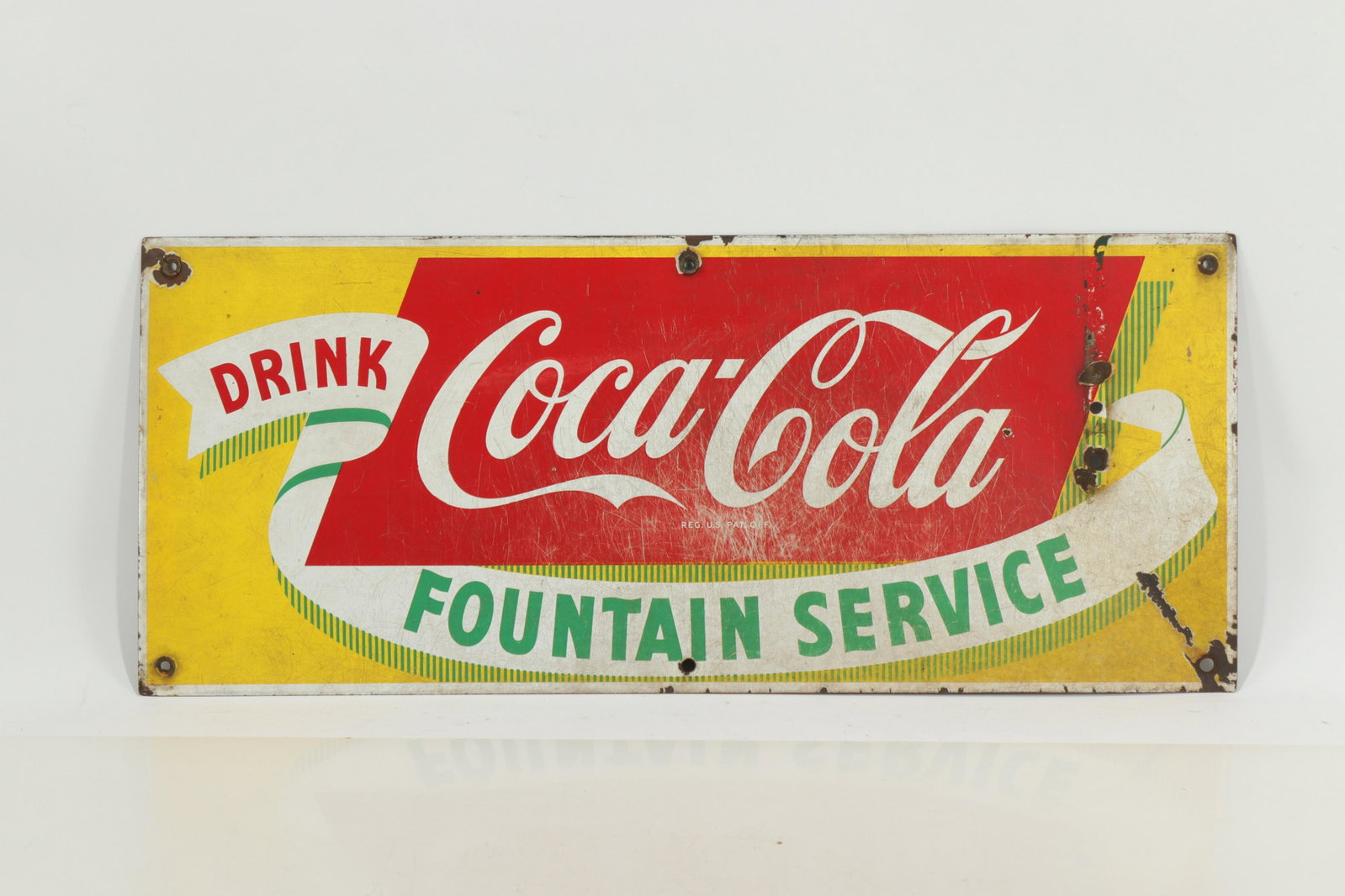 Coca-Cola FOUNTAIN SERVICE METAL SIGN: DRINK Coca-Cola FOUNTAIN SERVICE METAL SIGN (JOHB409)(MM) Dimensions: 12 x 28 Property from the Connecticut Home of a lifelong Animation Art Collector
