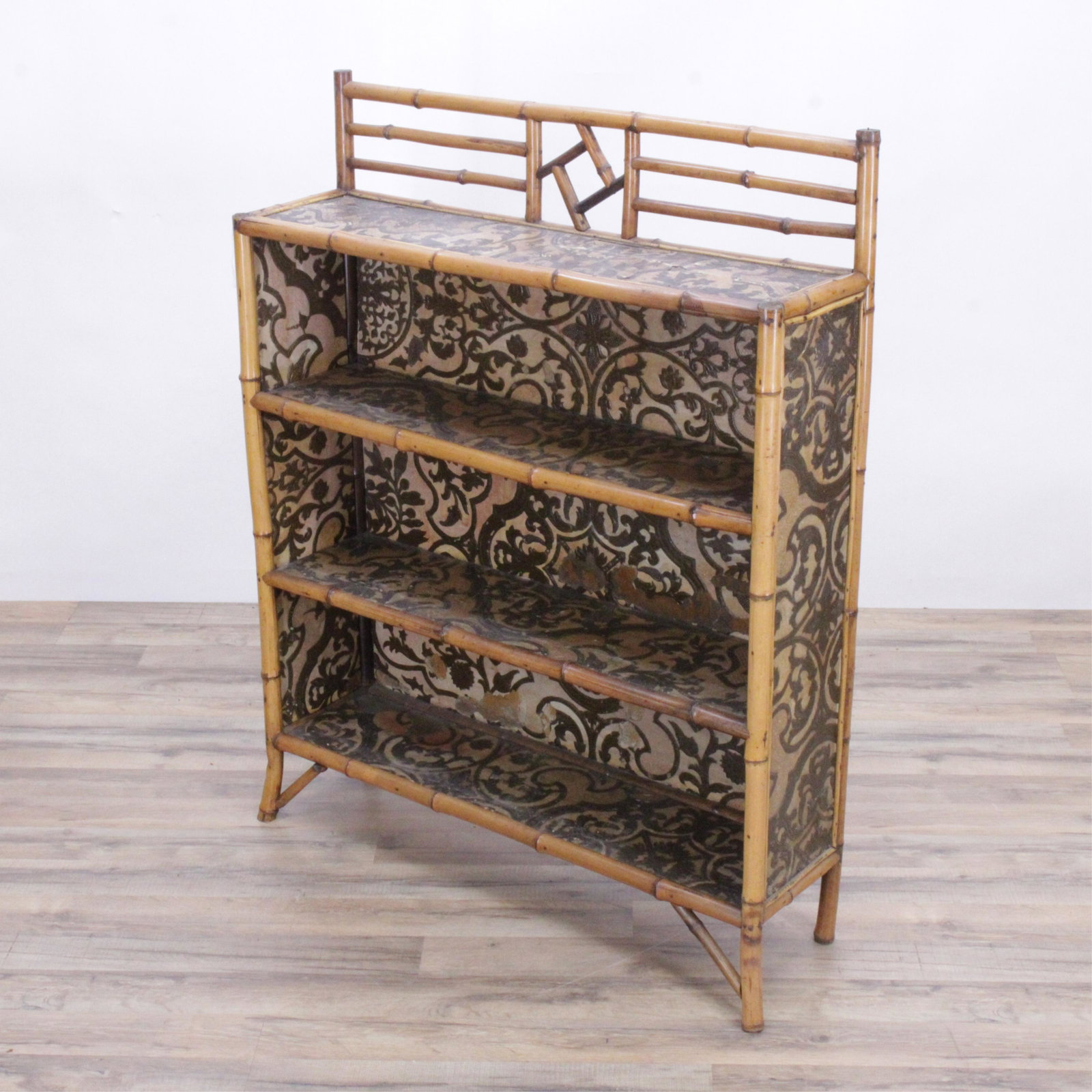 Rattan and Pressed Paper Bookshelf: Rattan and Pressed Paper Bookshelf (MBRE239)(MS) Dimensions: 45 1/2" H x 36" W x 10" D Property from a Riverside Drive, NYC collection