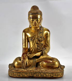 Burmese Mandalay Seated Buddha: Burmese Mandalay Seated Buddha. Giltwood with inlaid glass, Early to mid 20th century. 19.5" H x 14.5" W x 10.5" D Property from a private estate, New York City