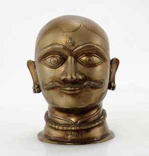 Brass Indian Head: Brass Indian Head, early 20th century. Intended as cover for sacred lingam. 11" H x 7" W x 6" D Property from a private estate, New York City