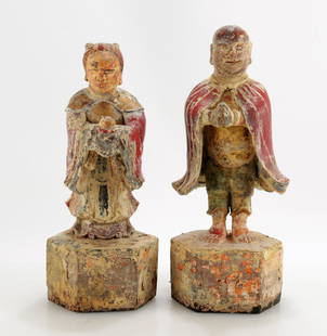 Two Chinese Carved and Painted Wood Figures: Two Antique Chinese Carved and Painted Wood Figures, Female figure holding an offering, the male with arms together in front, both with remnants of heavy polychrome and attractive patina of age. 