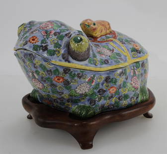 Large Chinese Porcelain Frog Box: Large Chinese Porcelain Frog Box, late 19th to early 20th c. Glazed in floral motif with small molded frog on a coin riding on the back. With a bespoke wood stand. 6 1/2" x 12" x 9" without stand Prop