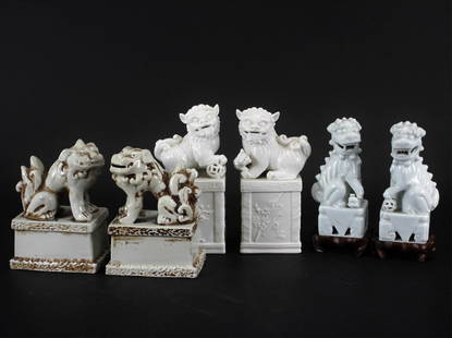 Three Pairs of Vintage Porcelain Guardian Dogs: Three Pairs of Vintage Porcelain Guardian Dogs, 20th C. Tallest pair is finely modeled and glazed in a Dehua style, the smallest of a more cool white glaze, the third of a more South Chinese style