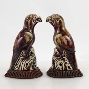 Pair of Chinese Flambe Glazed Porcelain Parrots: Pair of Chinese Flambe Glazed Porcelain Parrots, early 20th c. Pair of molded parrots in a variegated flambe glazed ground neatly to the foot. Each with a bespoke carved wood stand. 11.5" H