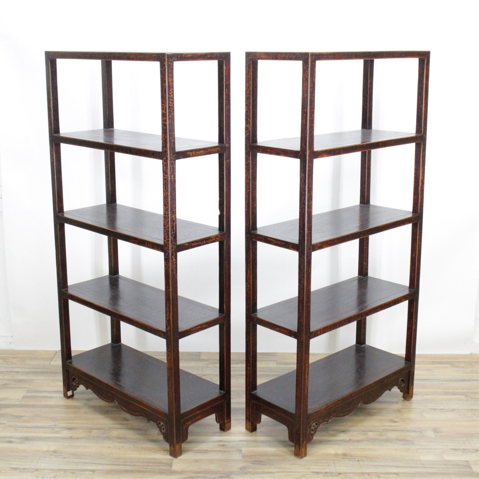 Pair Tall Chinese Style Fixed Shelf Stands: Hardwood stands or bookshelves in a burgundy color faux craquelure finish. 69"H x 33.75W x 14 Property from a longtime Connecticut Collector