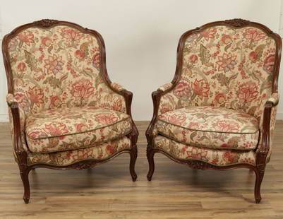 Pair of Louis XV Style Beechwood Bergeres: Pair of Louis XV Style Beechwood Bergeres upholstered in foliate print. 43.25" H x 32.5" W x 36" D Property from a Fine Collection of Antiques & Decorative Art, Rumson, New Jersey.