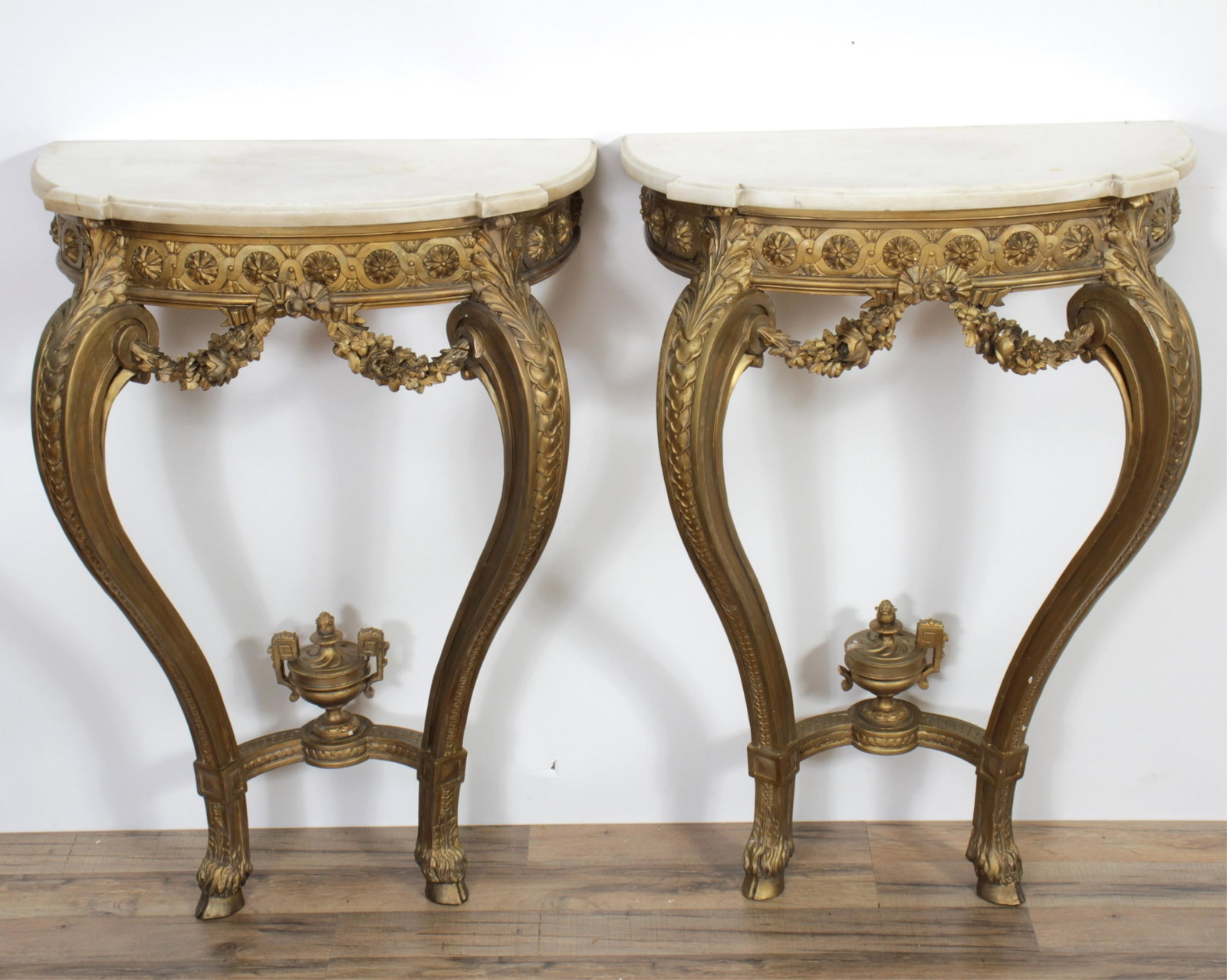 Pair of Louis XVI Style Giltwood Consoles: Pair of Louis XVI Style Giltwood Consoles, 20th C. 37" H x 25.25" W x 12.5" D Property from a Fine Collection of Antiques & Decorative Art, Rumson, New Jersey.