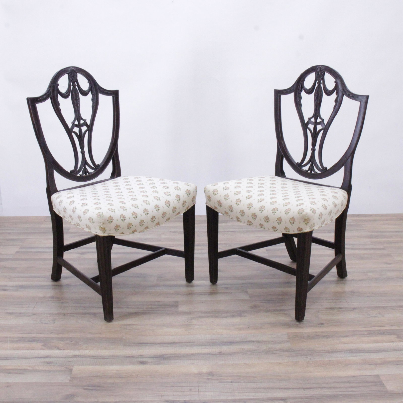 George III Carved Mahogany Side Chairs: George III Carved Mahogany Side Chairs, c.1790, Hepplewhite design, shield shaped back, pierced splat with drapery and leaf carving, tapered legs 38"H x 22"W x 18"D Property from a family collection b