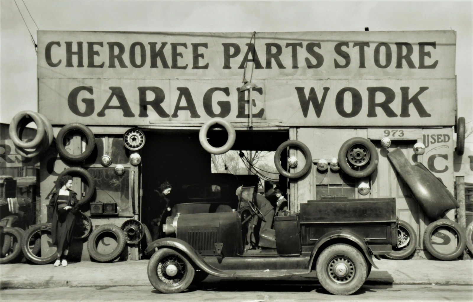 Two Walker Evans Archival Pigment Prints: Later reprinted photos of Walker Evan's from public domain images made available under U.S. Government contract and printed by Sven Martson and John T. Hill. Cherokee Parts Store, Garage Work and Savo