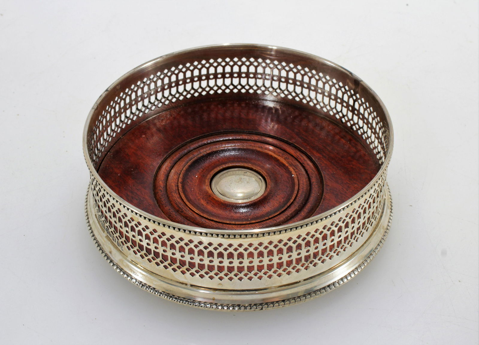 English .925 Silver Wine Coaster: Dimensions:5.5" DIA by 1.75" H Property from the Collection of Scott Newman & Gregory Long.