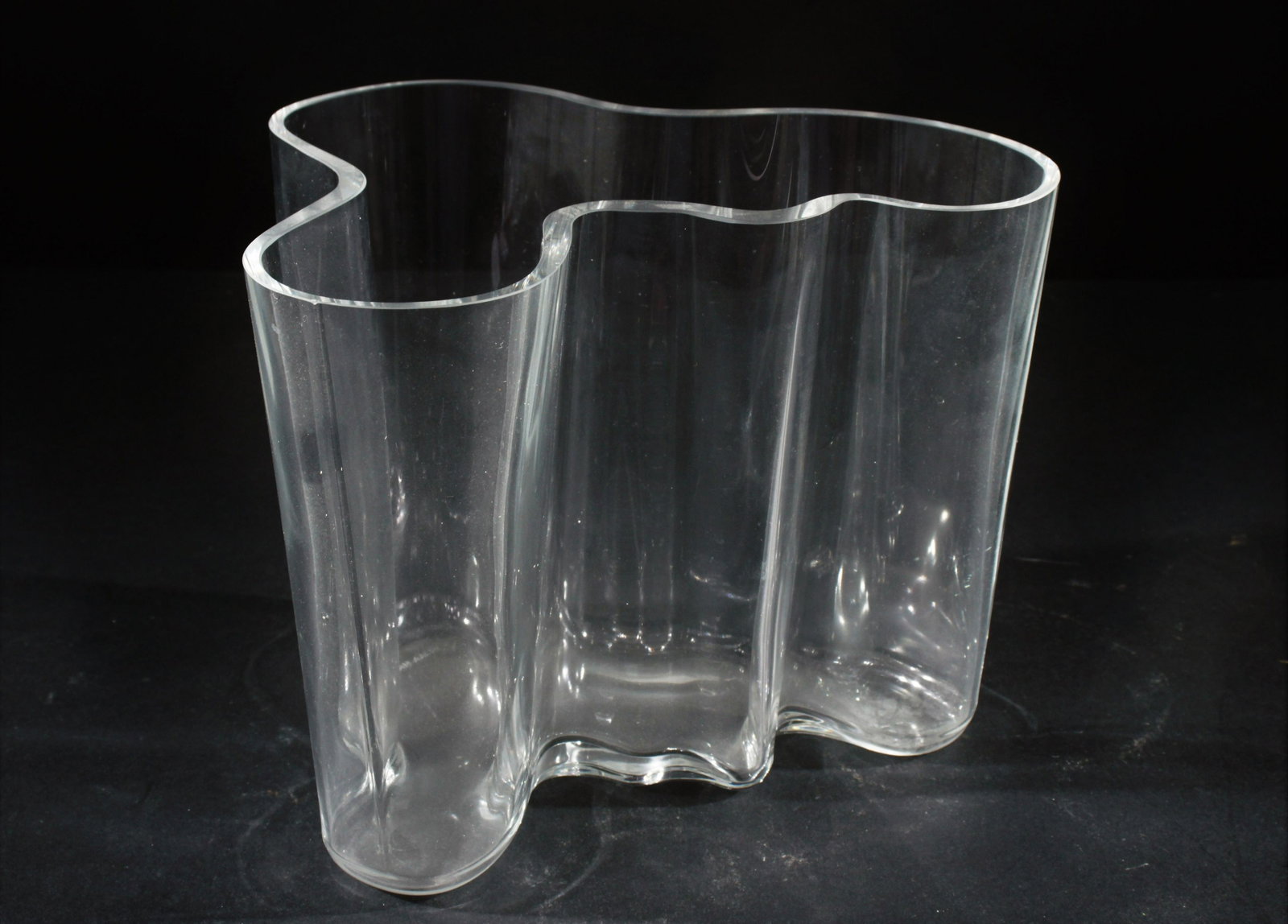 Alvar Aalto Clear Glass Lobed Vase: Alvar Aalto Clear Glass Lobed Vase. Dimensions:6.5" H by 8" W Property from the Collection of Scott Newman & Gregory Long.
