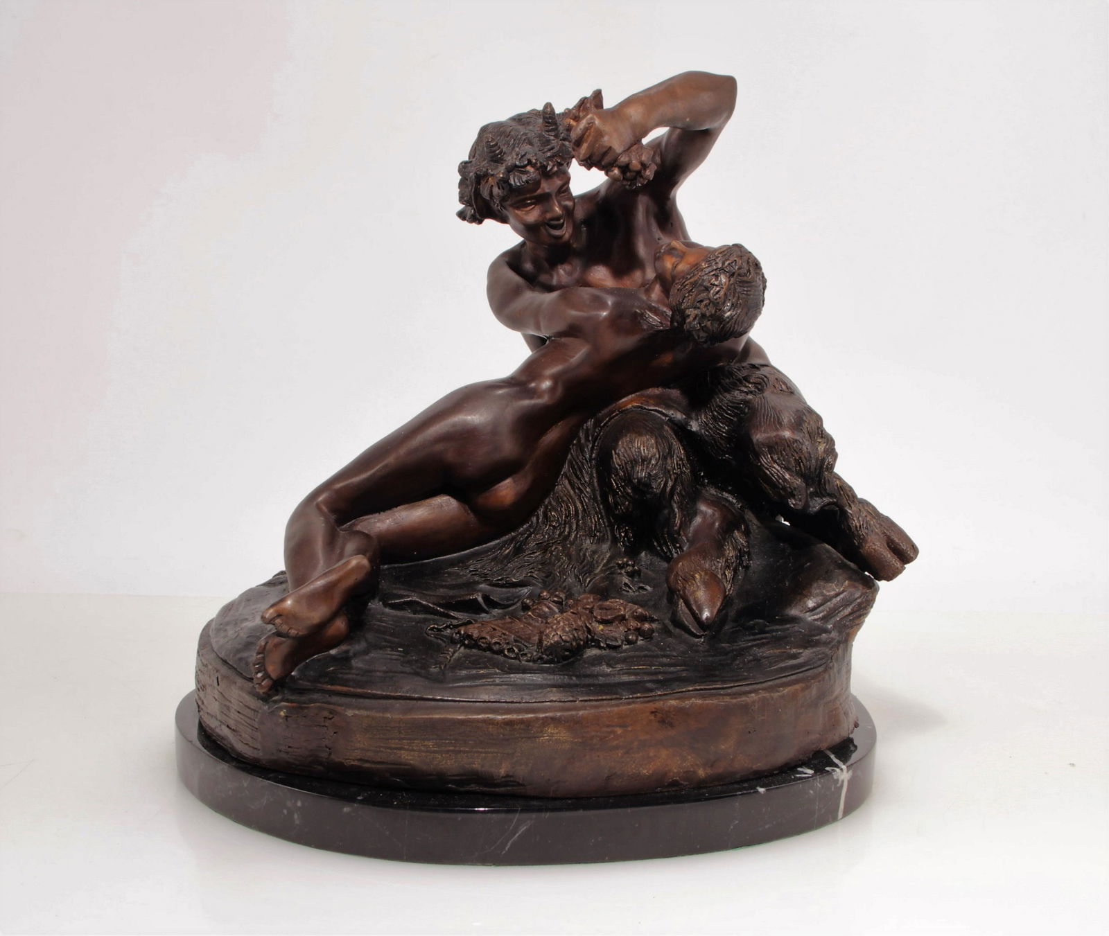 After Claude Michel Clodion - Nymph and Satyr: After Claude Michel Clodion (French, 1738 - 1814). Nymph and Satyr, bronze on black marble base.Dimensions: 13 H x 12" W x 9" D
