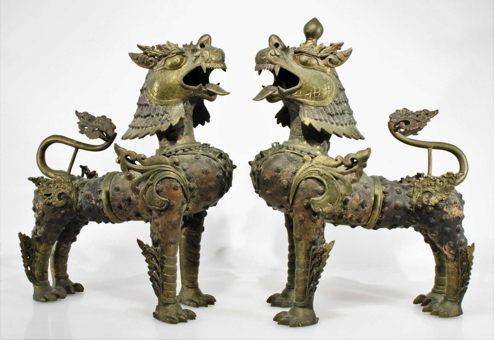 Pair Tibetan Kylin Brass Foo Dogs: Pair Tibetan Kylin Brass Foo Dogs Dimensions: 24.25" H x 18" L