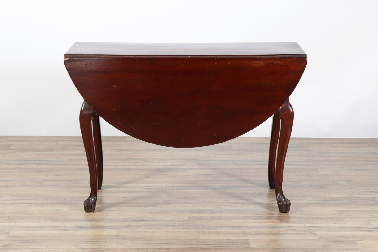 Chippendale Style Mahogany Drop-Leaf Table: Chippendale Style Mahogany Drop-Leaf TableDimensions: 28.75" H x 42" W x 16" D