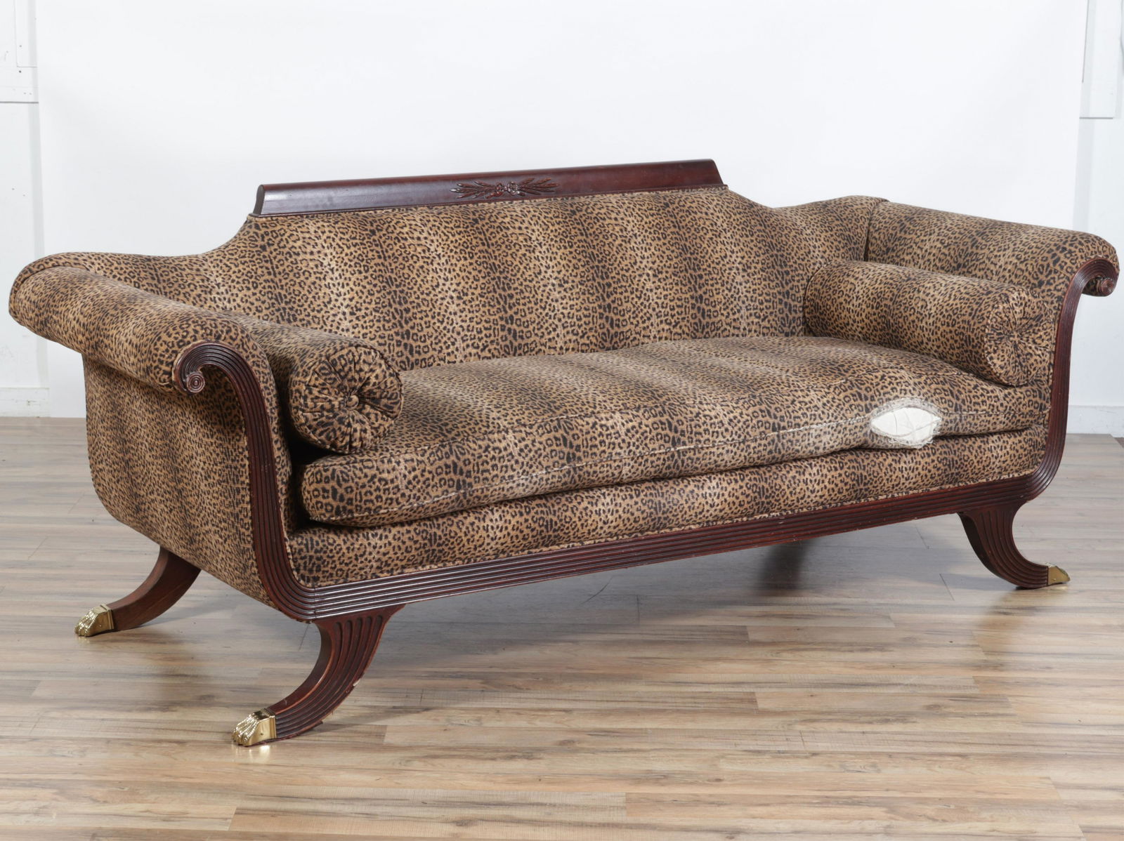 19C Duncan Phyfe Style Sofa: Leopard print upholstery. One seat cushion, two bolsters. Hairy paw metal cap feet.Dimensions: 84"L x 30 deep overall x 33H seat 20H