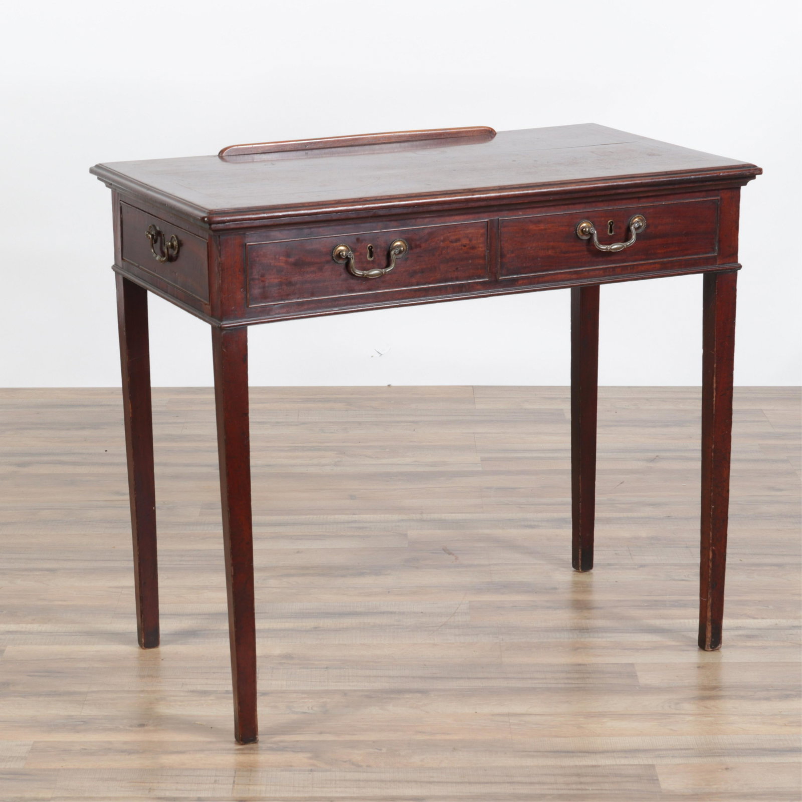 Adjustable Writing/Drawing Surface Desk: Adjustable positions writing/drawing top with ledge- stop and moulded edge. One drawer, three false front drawers. Dimensions: 20" x 35.75 x 31.75H