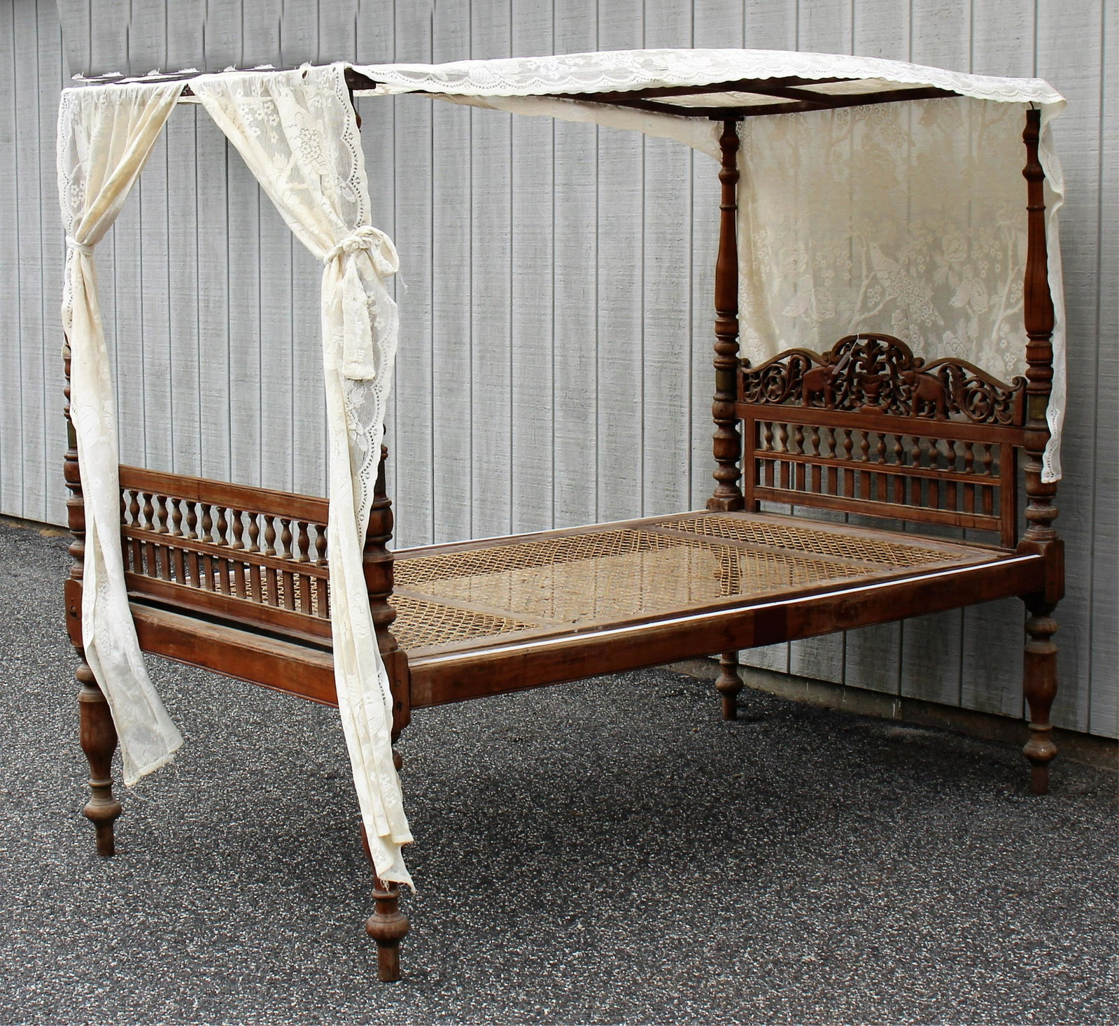 19th C. Anglo Indian Teak Twin Size Bed: 19th C. Anglo Indian carved and turned teak wood twin size bed with two canopies, one gently arched and one slightly arched with aviary theme lace drapery, no bolts for bed Dimensions: Overall, 45"W x