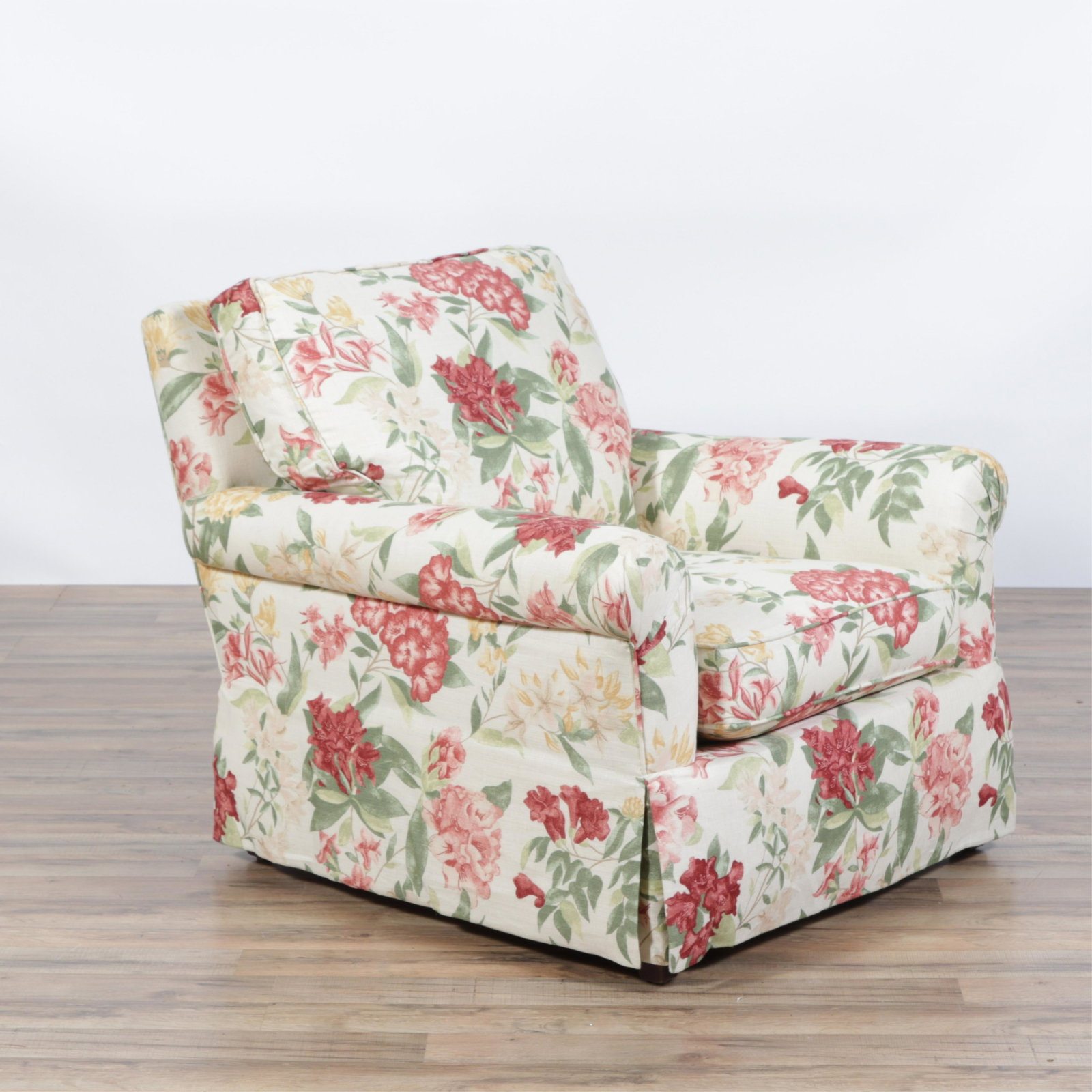 English Style Floral Upholstered Lounge Chair: English Style Floral Upholstered Lounge Chair, waterfall skirt, off white ground with red and rust floral foam seat, back down cushion Dimensions: 32"W x34"D x 29 1/2"H