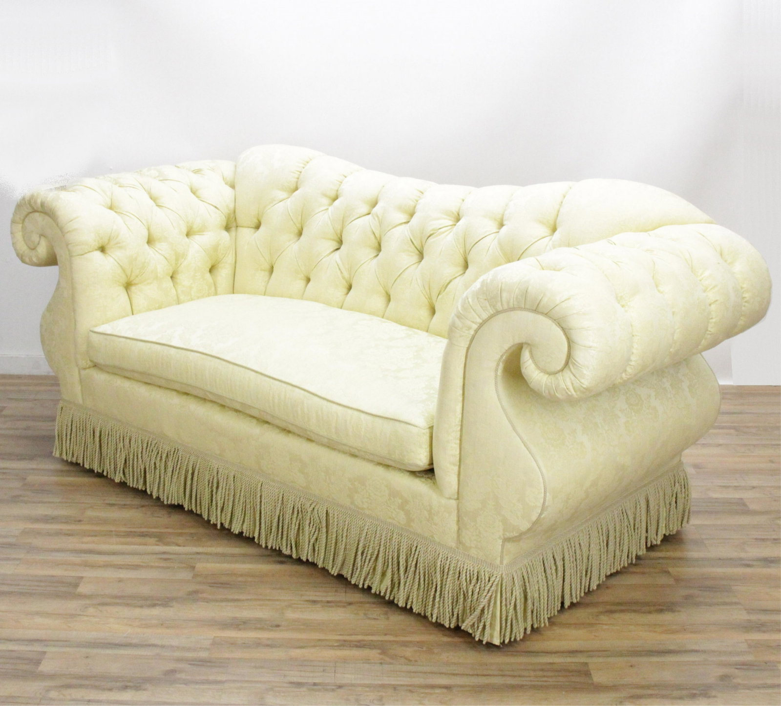 Victorian Style Upholstered Sofa: Victorian Style Upholstered Sofa upholstered in lemon foliate silk brocade, supplied by Greenbaum Interiors. Dimensions: 39.5" H x 87" W x 38" D
