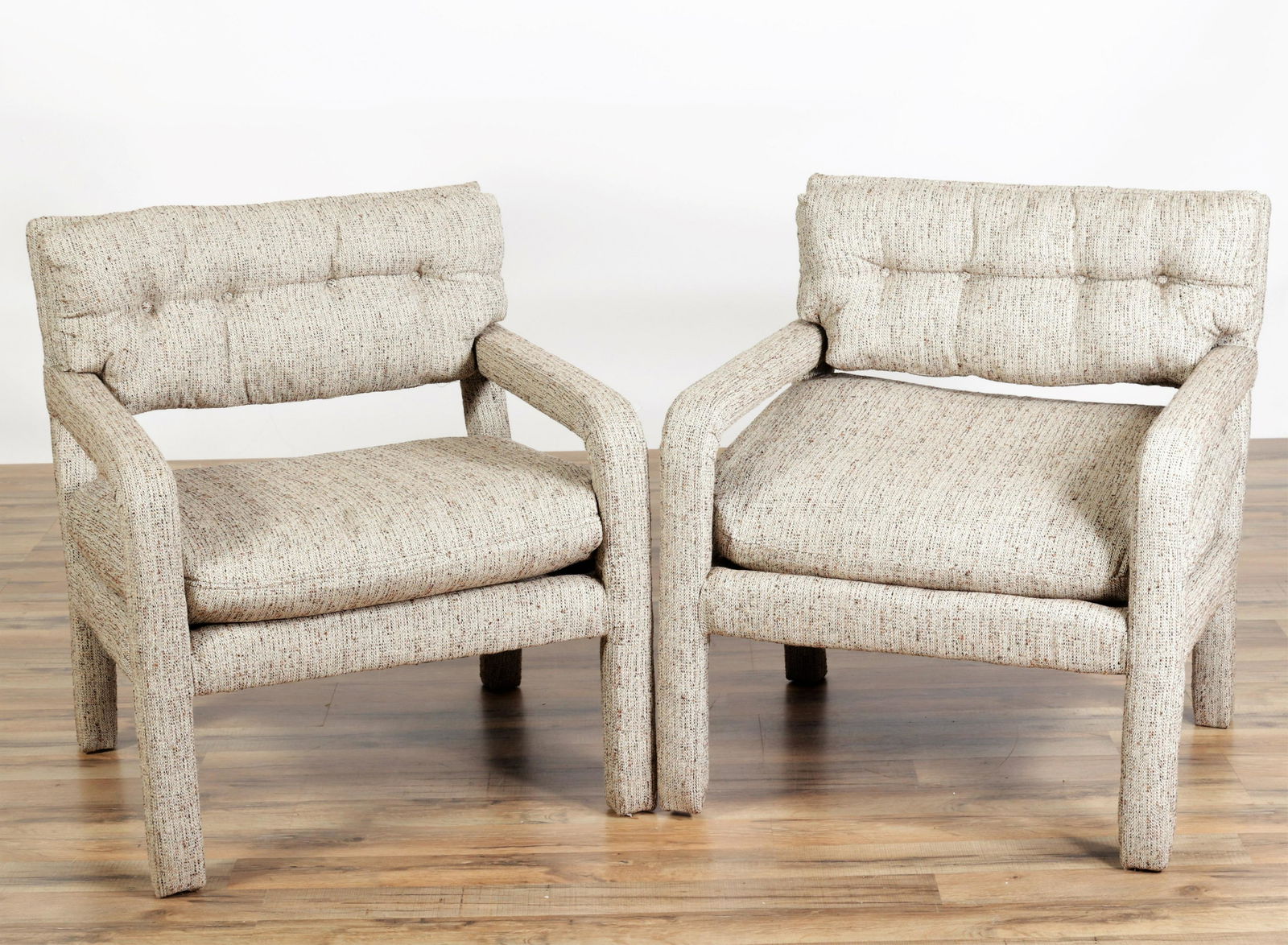 Pair Milo Baughman Style Over Upholstered Chairs: Pair Milo Baughman Style Over Upholstered Armchairs, upholstered in specked linenDimensions: Slightly frayed.