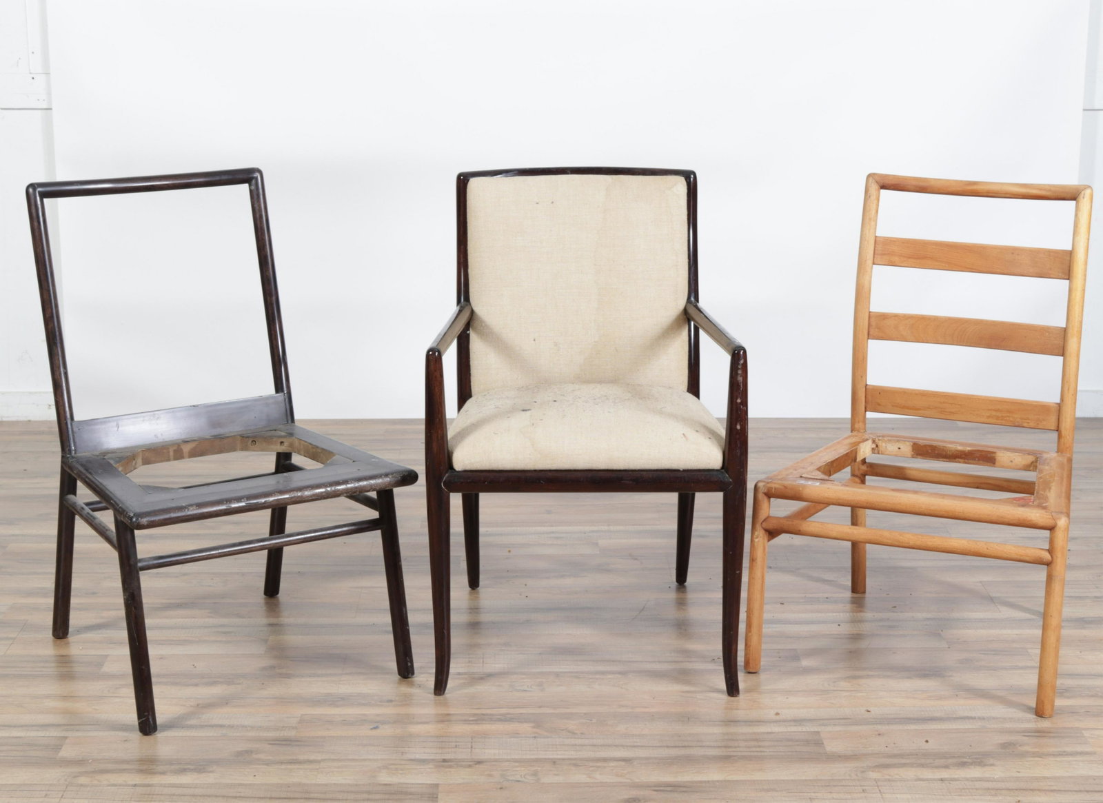 3 Robsjohn Gibbings Chairs: 3 Robsjohn Gibbings Chairs, 2 side, 1 arm, armchair upholstered in beige linen Dimensions: 34.25" H x 21.25" W x 21.5" D
