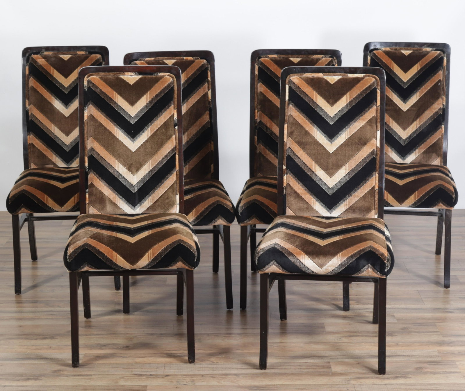 8 Directional Mahogany Stained Dining Chairs: 8 Directional Mahogany Stained Dining Chairs, including 2 armchairs, upholstered in brown geometric velour Dimensions: 39.25" H x 19" W x 23" D
